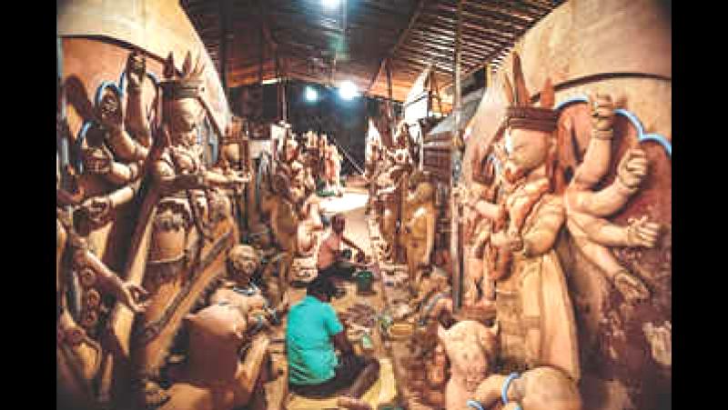 Skilled craftsmen busy preparing for Durga Puja festivities in Bengaluru.